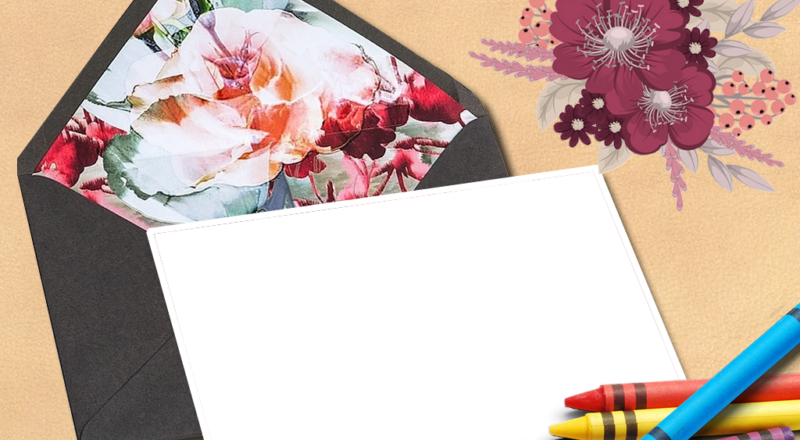 Imikimi flowe with a black envelope with a picture and crayons